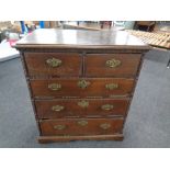 A George III oak five drawer chest with brass drop handles