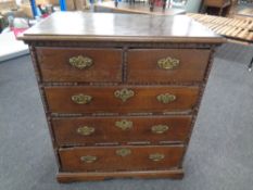 A George III oak five drawer chest with brass drop handles