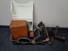 A box containing vintage leather case, wall clock,