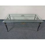 A contemporary metal and glass rectangular coffee table