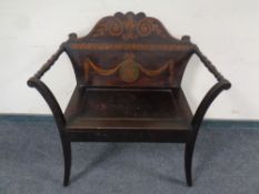 An Edwardian painted scroll arm hall seat