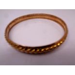 A 9ct gold circular bangle. CONDITION REPORT: 16.