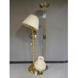 A brass standard lamp with shade together with matching table lamp with shade and a further