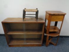A 20th century teak sliding glass door double bookcase together with two occasional tables and a
