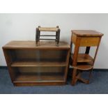 A 20th century teak sliding glass door double bookcase together with two occasional tables and a