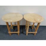 A pair of contemporary pine circular occasional tables