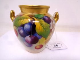 A Royal Worcester gilt-rimmed twin-handled vase, with hand painted Cherry decoration,