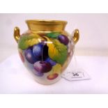 A Royal Worcester gilt-rimmed twin-handled vase, with hand painted Cherry decoration,