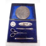 A cased silver manicure set and a compact stamped 800.