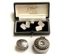 A pair of silver cufflinks and two silver boxes