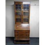 An Edwardian glazed oak bookcase