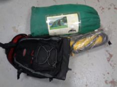 A freeman bubble tent in carry bag together with a heavy duty pump and a Timberland luggage case.