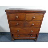 A late Victorian stained pine chest of five drawers