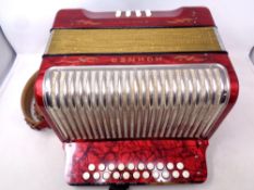 A Hohner Corso accordion in case