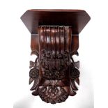 A 19th century style carved wooden wall bracket