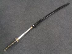 A reproduction Japanese katana in scabbard