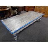 A painted pine low rectangular coffee table fitted two drawers