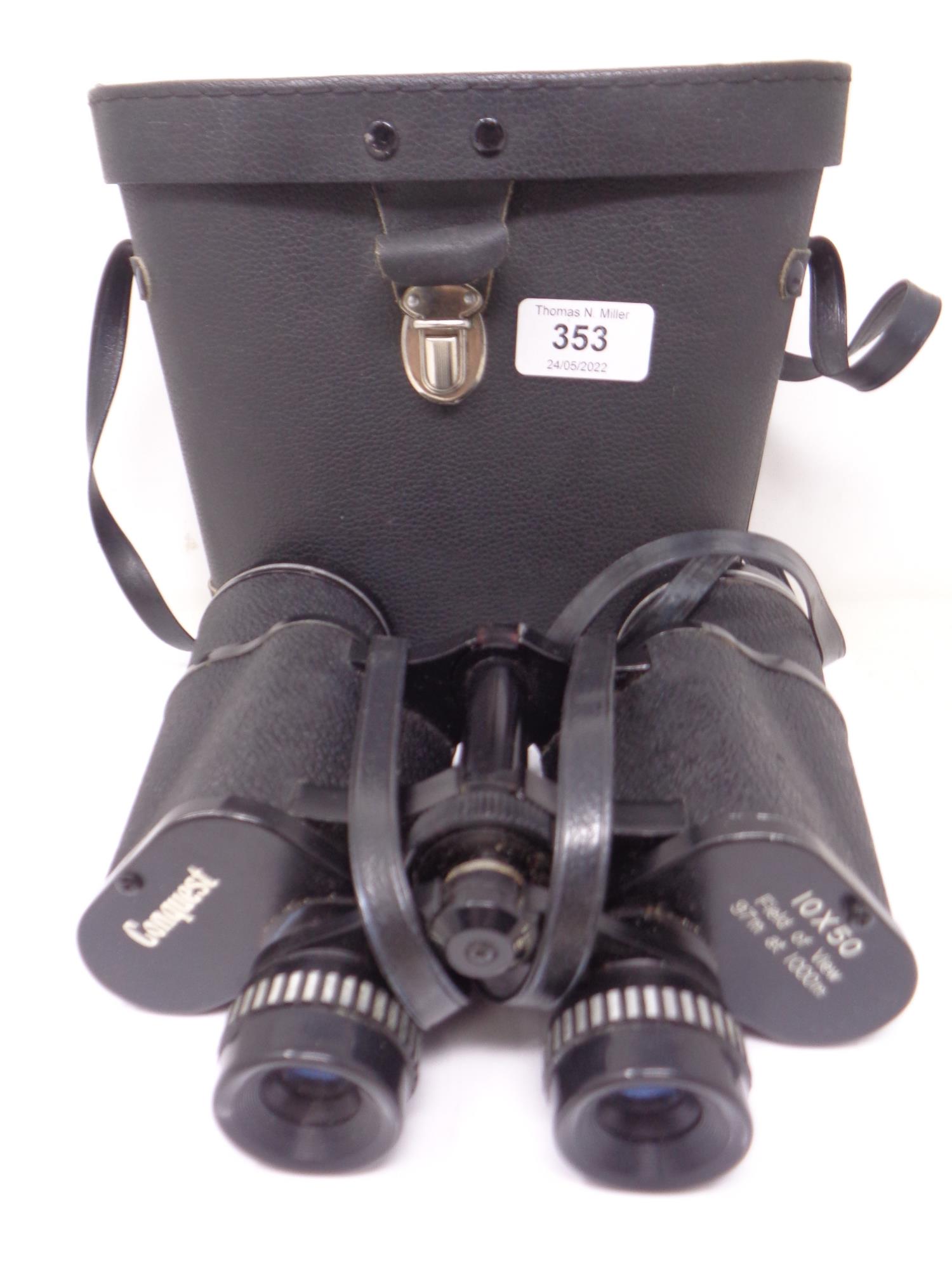 A pair of Conquest binoculars in leather case