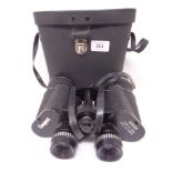 A pair of Conquest binoculars in leather case