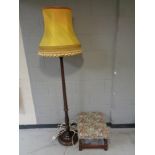 A beech standard lamp with shade together with a tapestry upholstered foot stool.