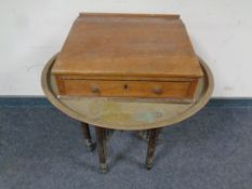 A pine writing slope together with a eastern brass topped circular table