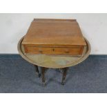 A pine writing slope together with a eastern brass topped circular table