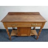 An Edwardian washstand fitted cupboard beneath