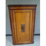 A 19th century inlaid mahogany corner cabinet