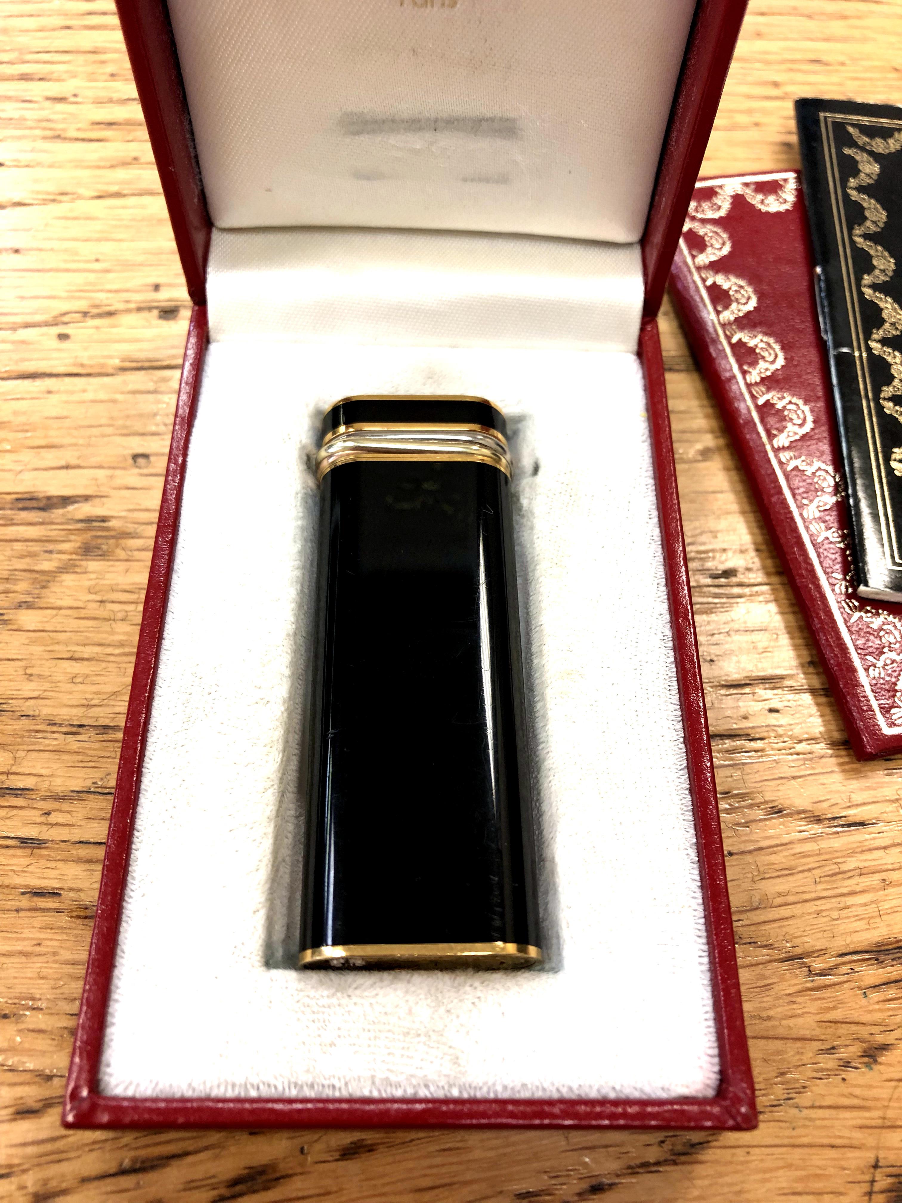 A must de Cartier gold-plated and black enamel lighter, circa 1989, stamped 62450T, - Image 2 of 4