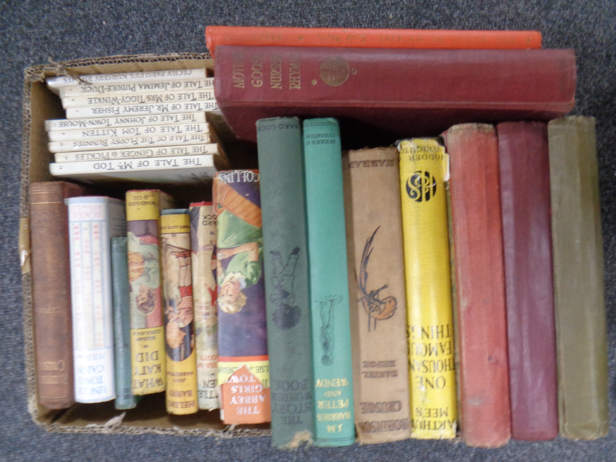 A box containing 20th century children's books to include J M Barrie's Peter and Wendy,