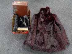 A faux fur coat together with a box containing assorted leather handbags,