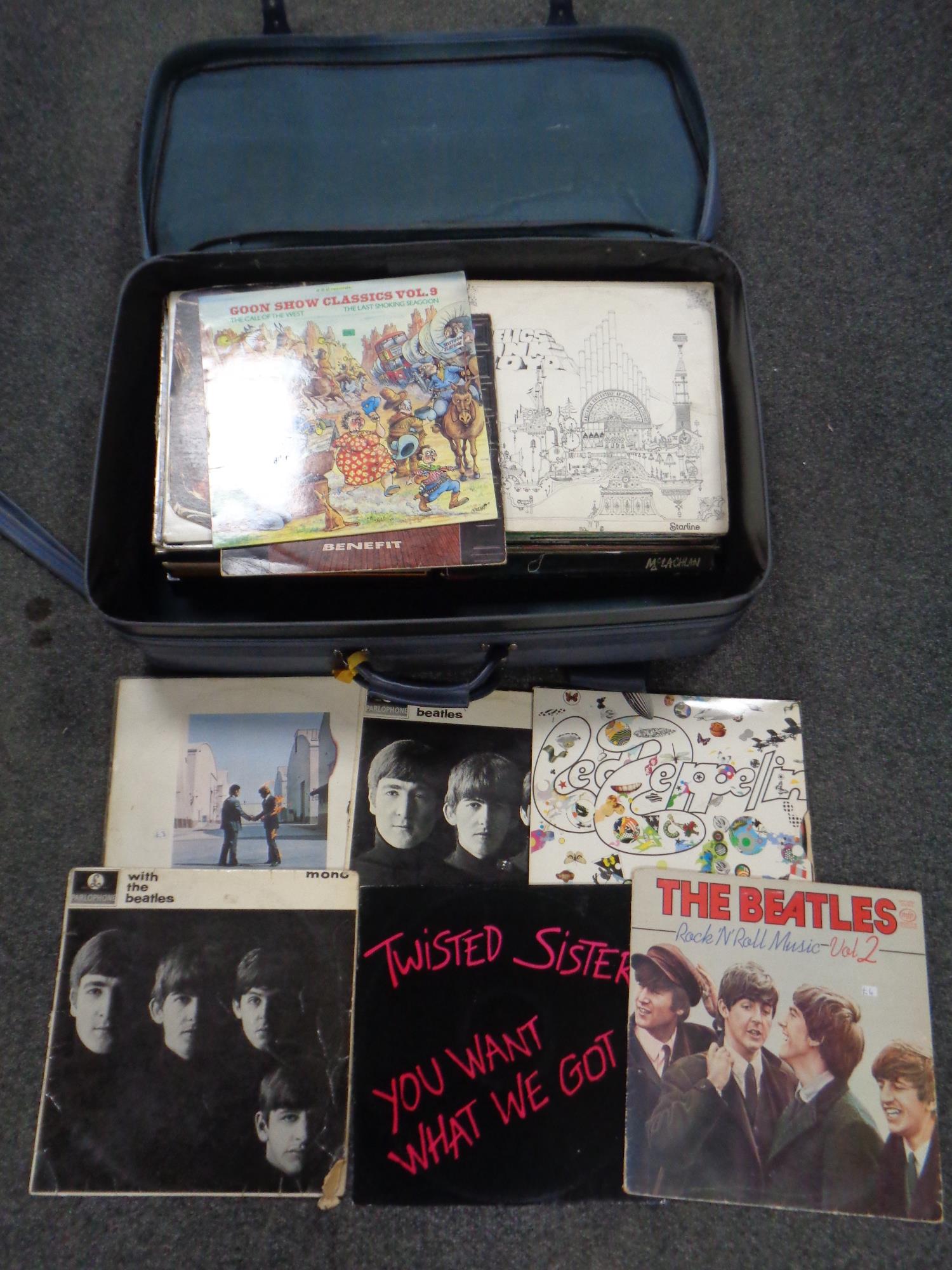 A suitcase containing vinyl LPs to include Pink Floyd, The Beatles, Rolling Stones,
