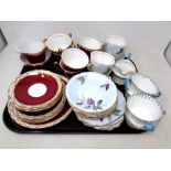 A tray containing two part-Windsor bone china tea services together with five further pieces of