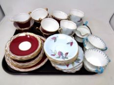 A tray containing two part-Windsor bone china tea services together with five further pieces of