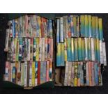 Two boxes containing ninety-five Biggles volumes by W E Johns