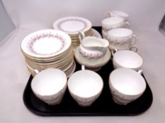 A tray containing a thirty eight piece Paragon Melody bone china tea service.