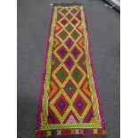 A Suzni kilim runner 284cm by 76cm