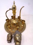 An eight piece Middle Eastern brass tea service comprising of teapots,