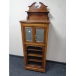 An Edwardian mahogany music cabinet