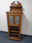 An Edwardian mahogany music cabinet