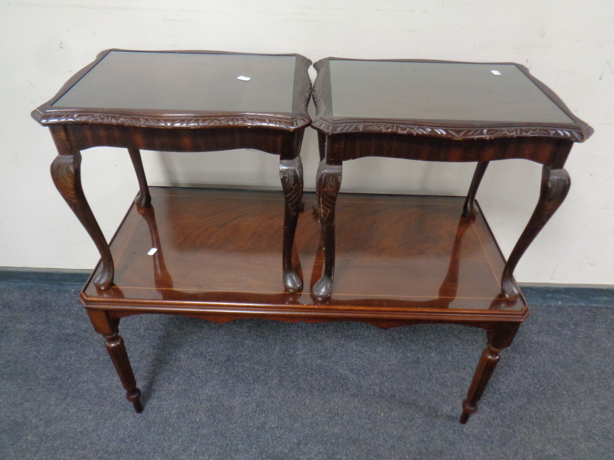 A reproduction inlaid mahogany coffee table together with a pair of similar lamp tables