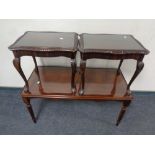 A reproduction inlaid mahogany coffee table together with a pair of similar lamp tables