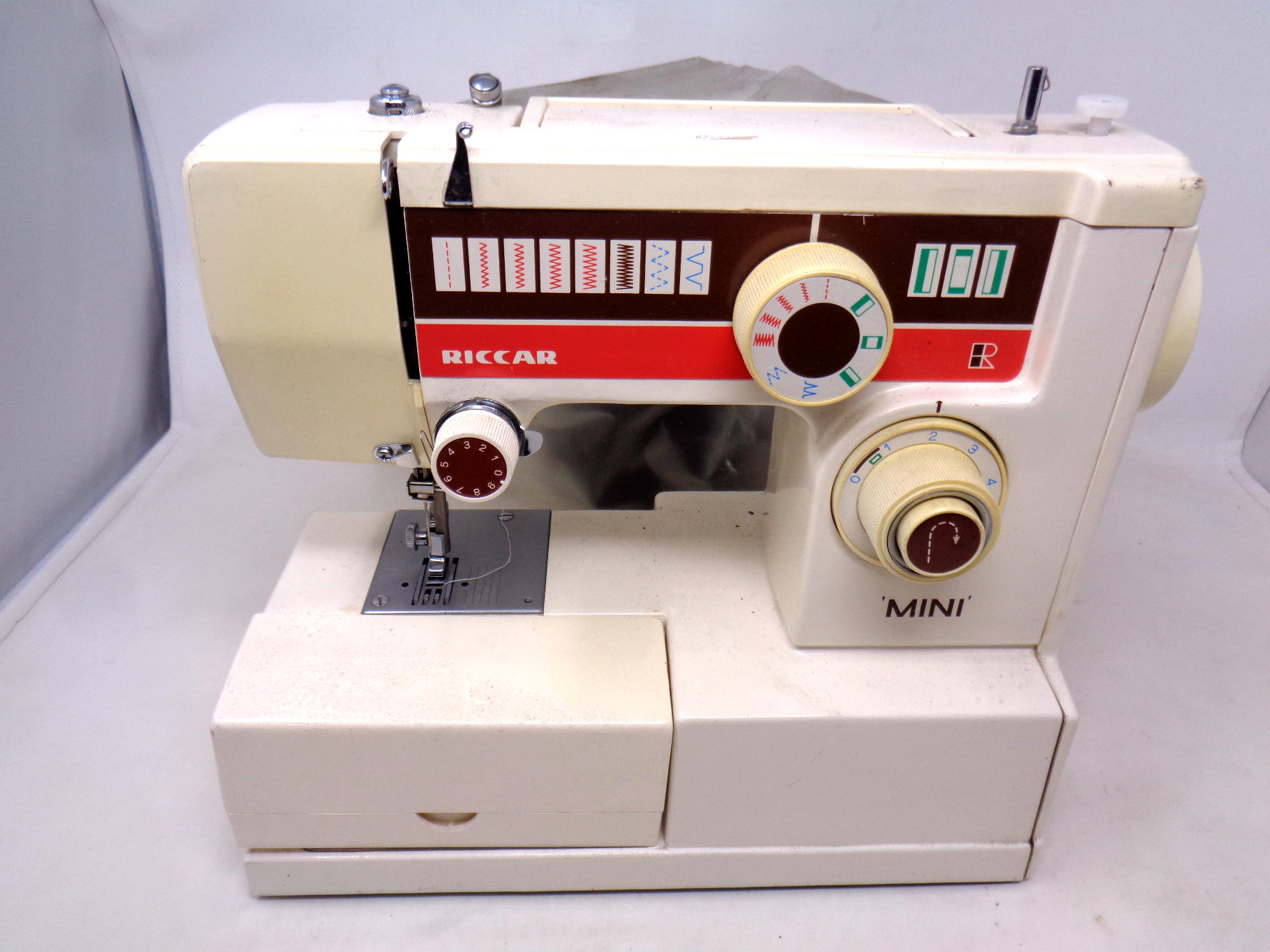 A Riccar electric sewing machine with foot pedal