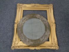 A 20th century circular bevel edged brass framed mirror together with a further gilt composite