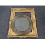 A 20th century circular bevel edged brass framed mirror together with a further gilt composite