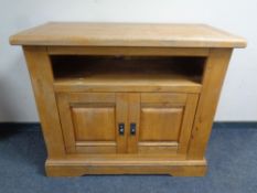 A contemporary oak sideboard fitted cupboards beneath