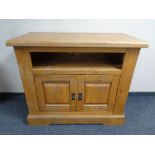 A contemporary oak sideboard fitted cupboards beneath