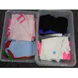 Two boxes containing assorted clothing to include lady's shirts, vest tops,