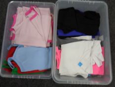 Two boxes containing assorted clothing to include lady's shirts, vest tops,