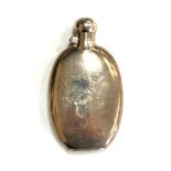 An antique silver hip flask,